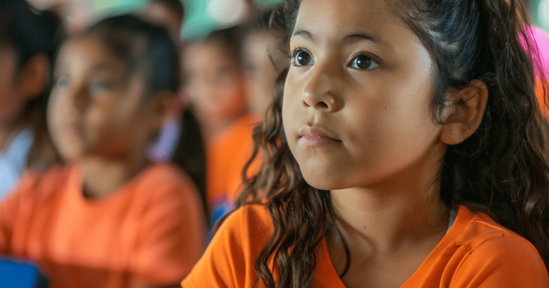 A girl being attentive during a lecture at her school