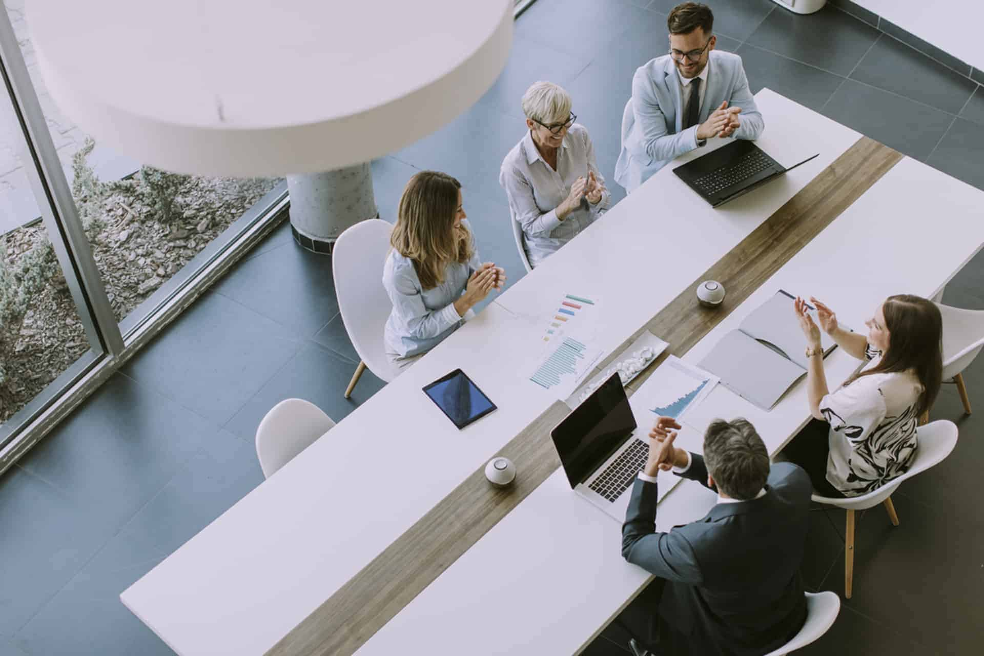 Aerial view of a group of people discussing something in a meeting