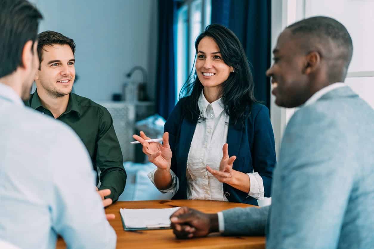 A woman explaining the benefits of plan administration during a meeting