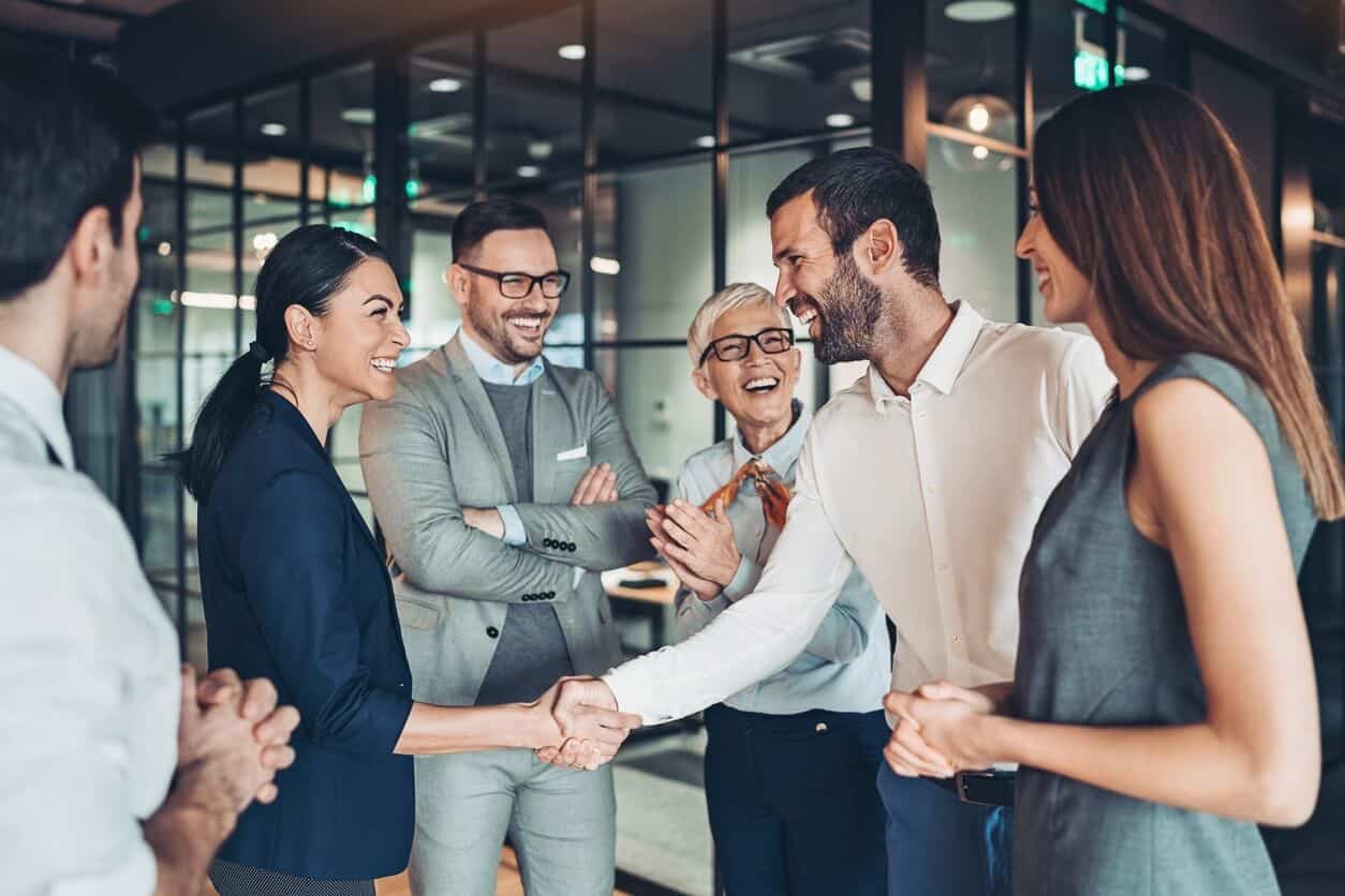 Business professionals shaking hands in an office