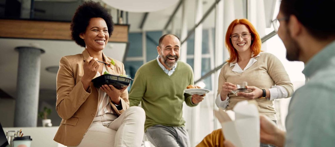 A group of people having lunch at their office in North America